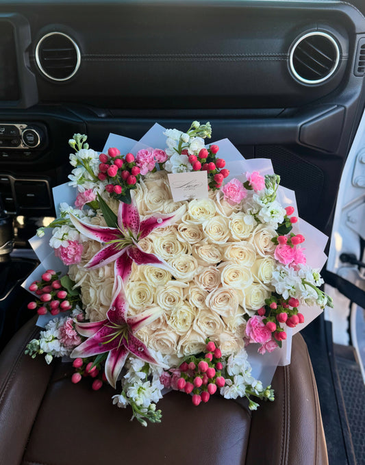 50 white roses + 2 lilies + filler rim